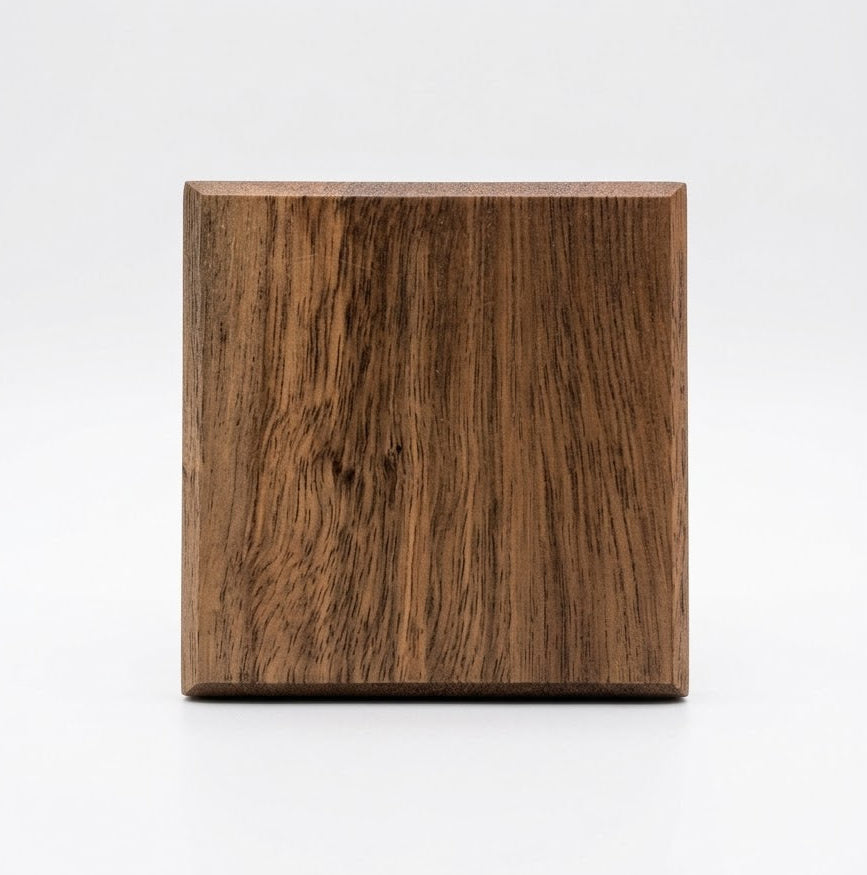Handmade spotted gum hardwood coaster, top view showing chamfered edge and grain