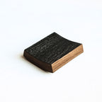 Charred underside of barrel stave coaster