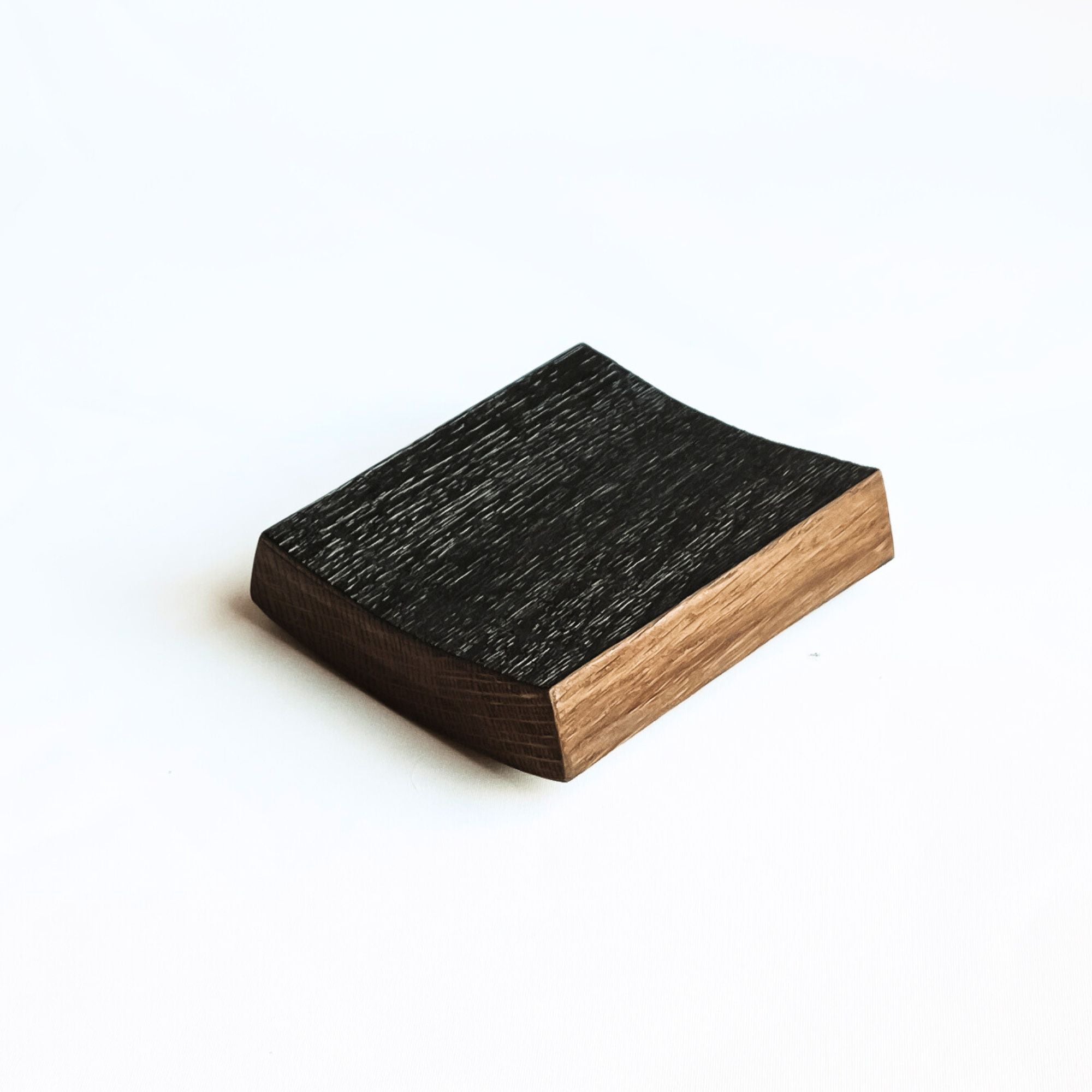 Charred underside of barrel stave coaster