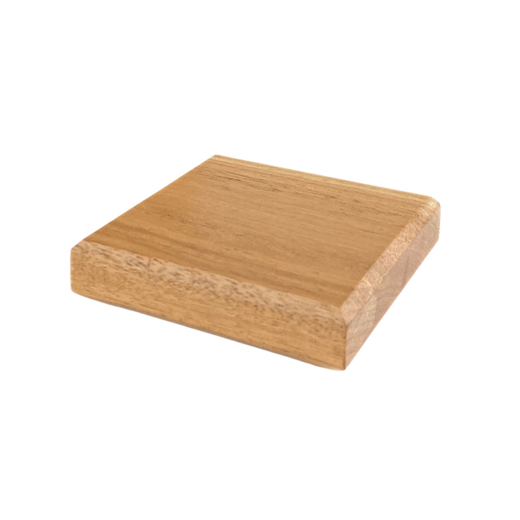 Side view of blackbutt hardwood coaster showing chamfered top and bottom edges
