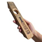 Hand holding engraved wine bottle holder - save water drink wine design.  3/4 view.
