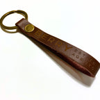 Leather keyring settlement gift engraved with a real estate agency logo