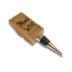 Close-up of personalised engraving on barrel stave wine bottle stopper