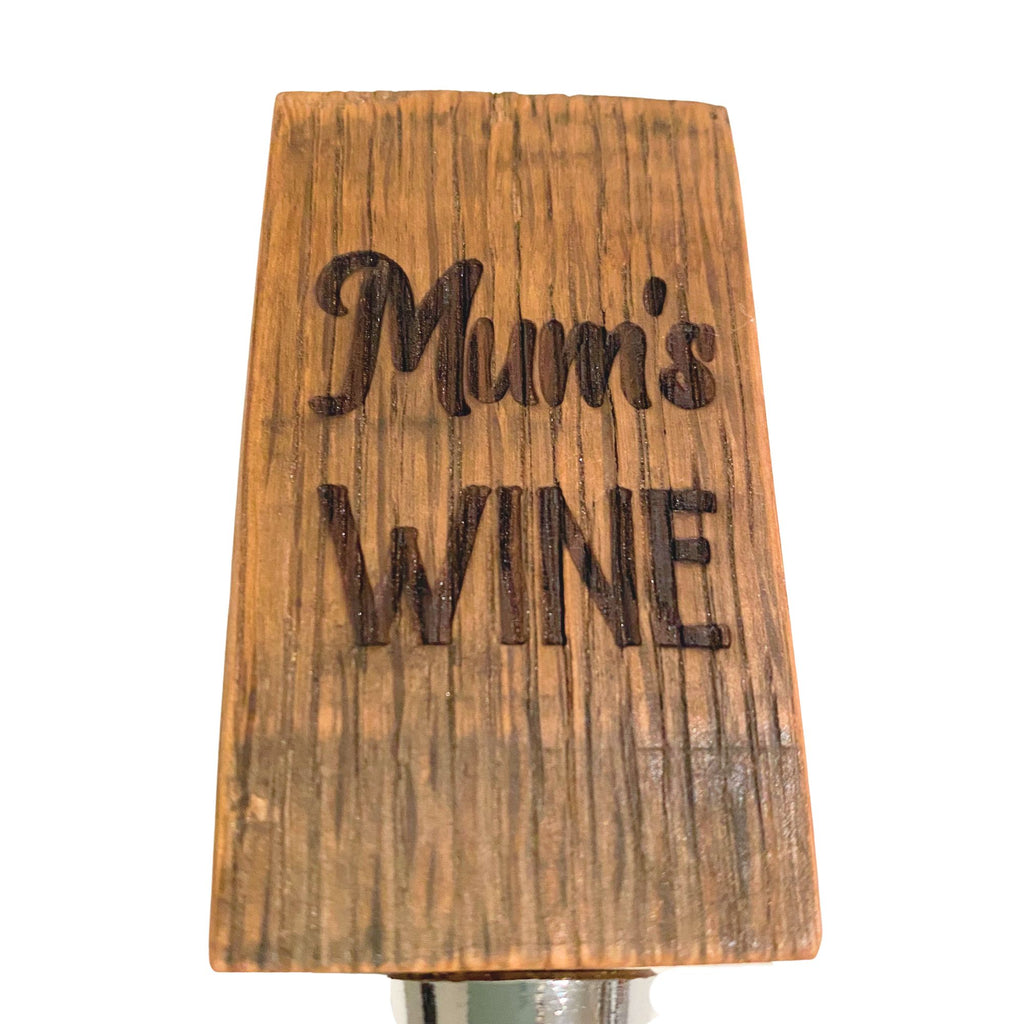 Close-up of laser engraving detail on barrel stave wine bottle stopper
