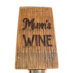 Close-up of laser engraving detail on barrel stave wine bottle stopper
