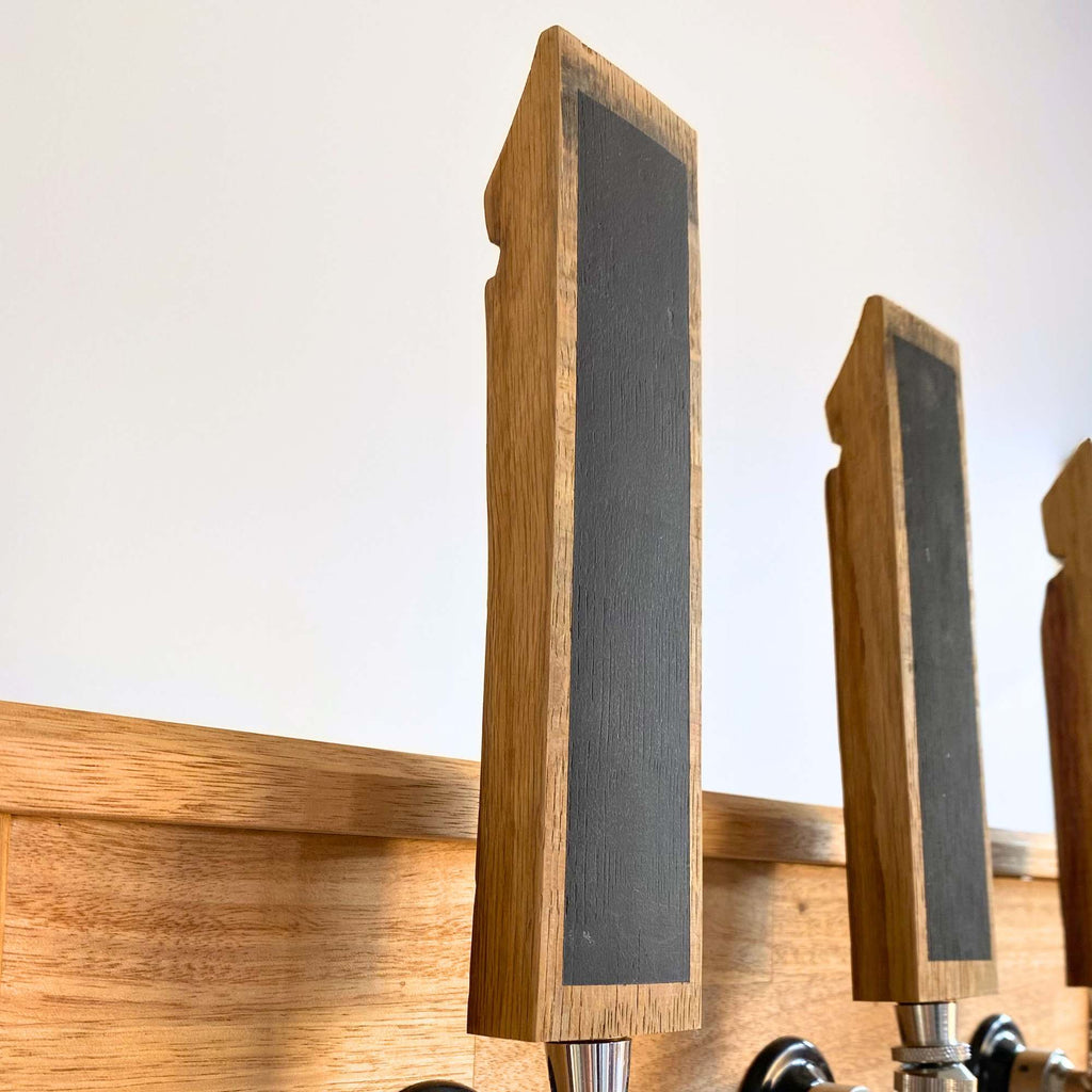 Barrel stave beer tap handle fitted to a home bar tap, side view
