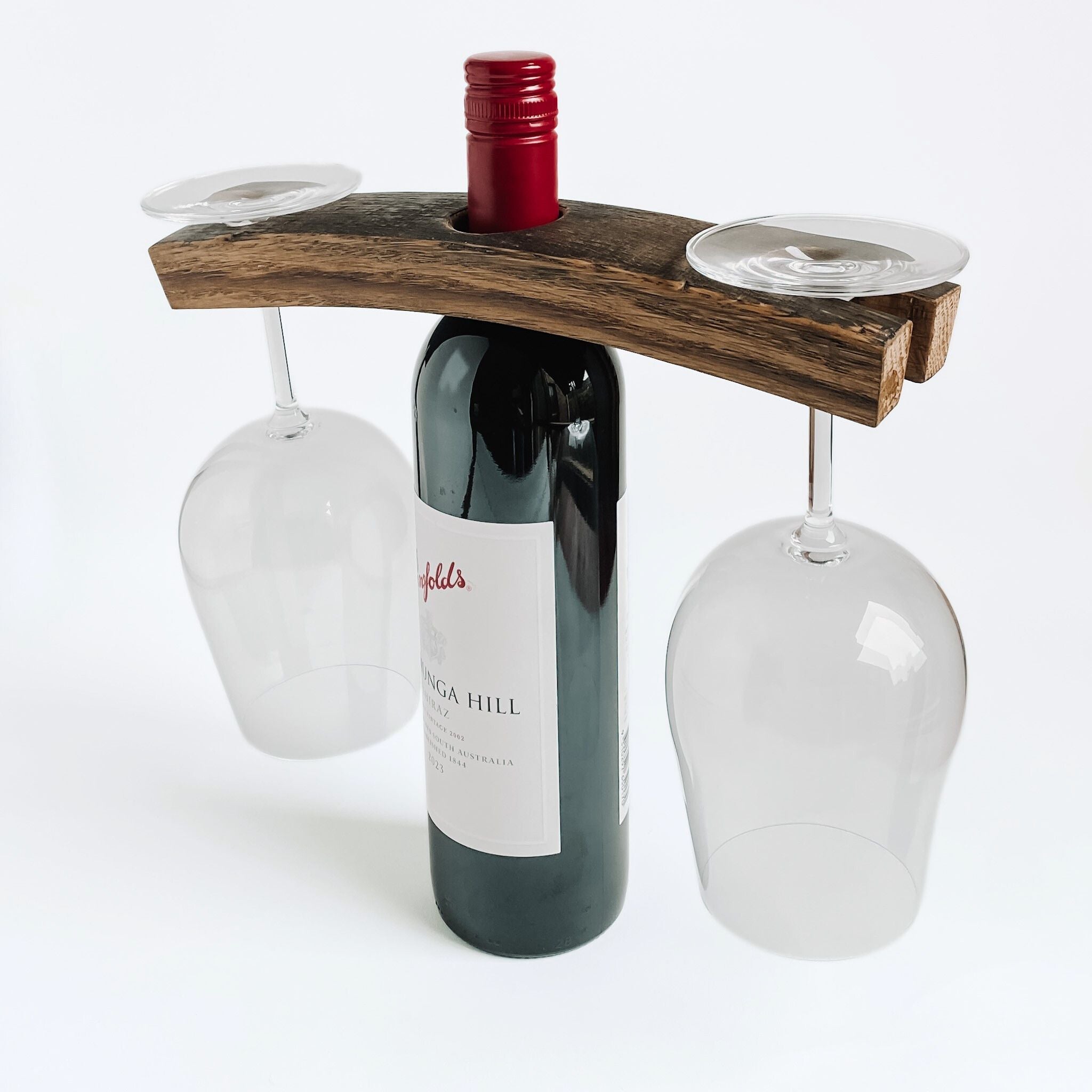 Barrel Stave 2 glass and one bottle holder over a bottle of wine with glasses on a white background